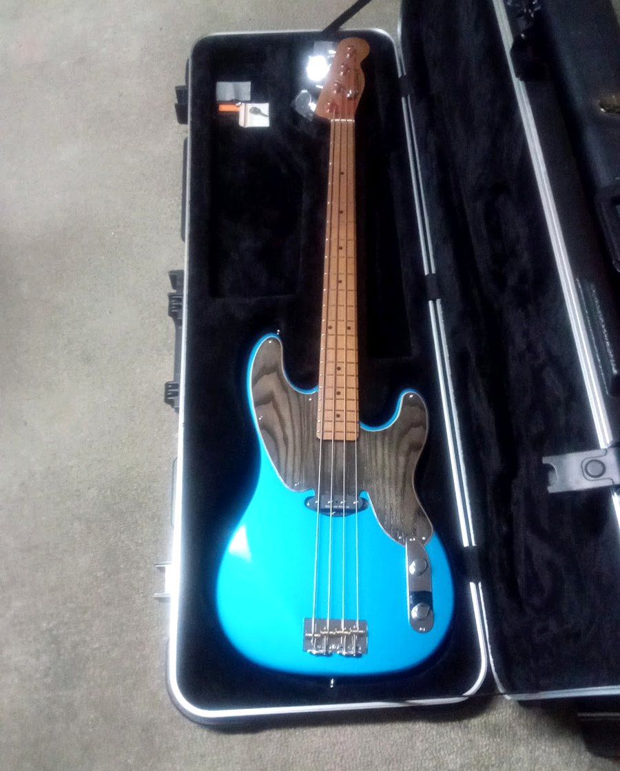 Blue four-string Caldwell custom instrument