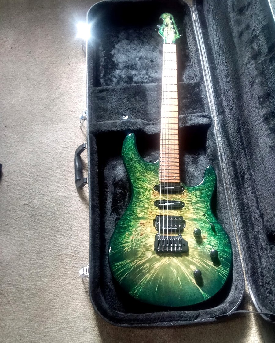 Green carved-top custom guitar