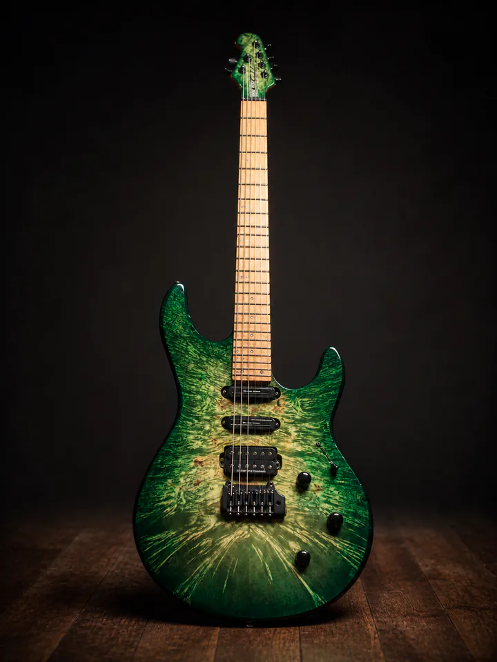 Green carved-top custom guitar on a professional studio background