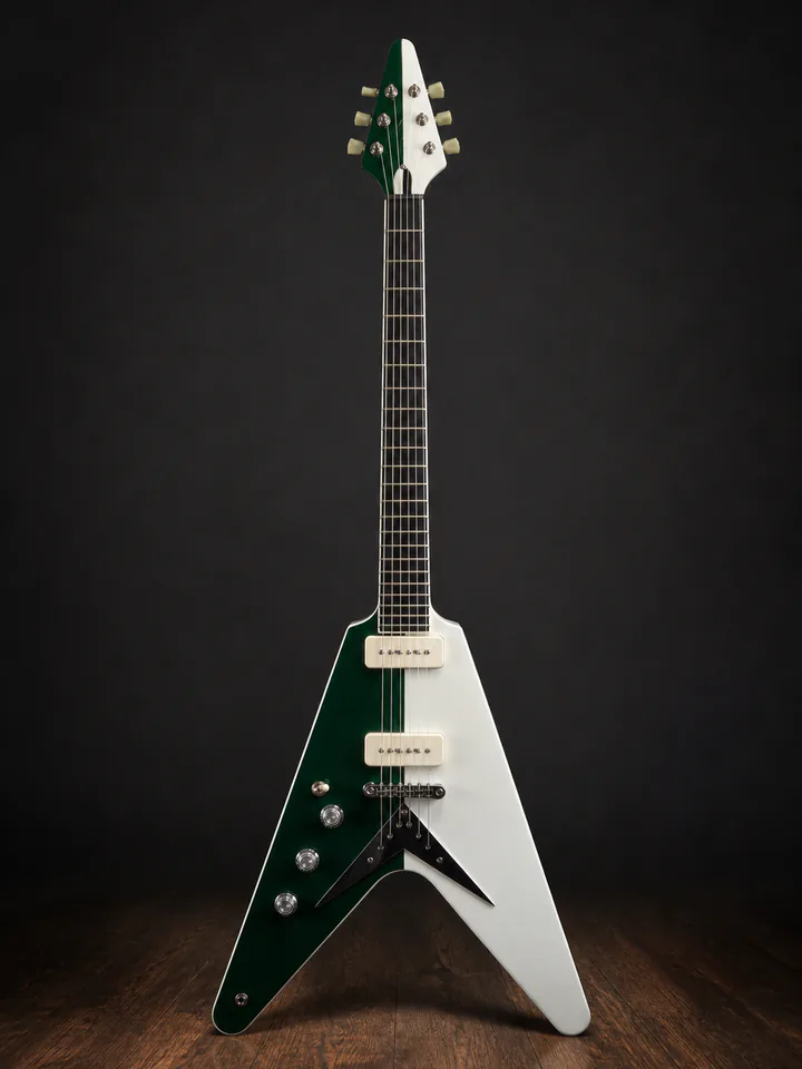 Green and ivory Caldwell Custom V guitar on a professional studio background
